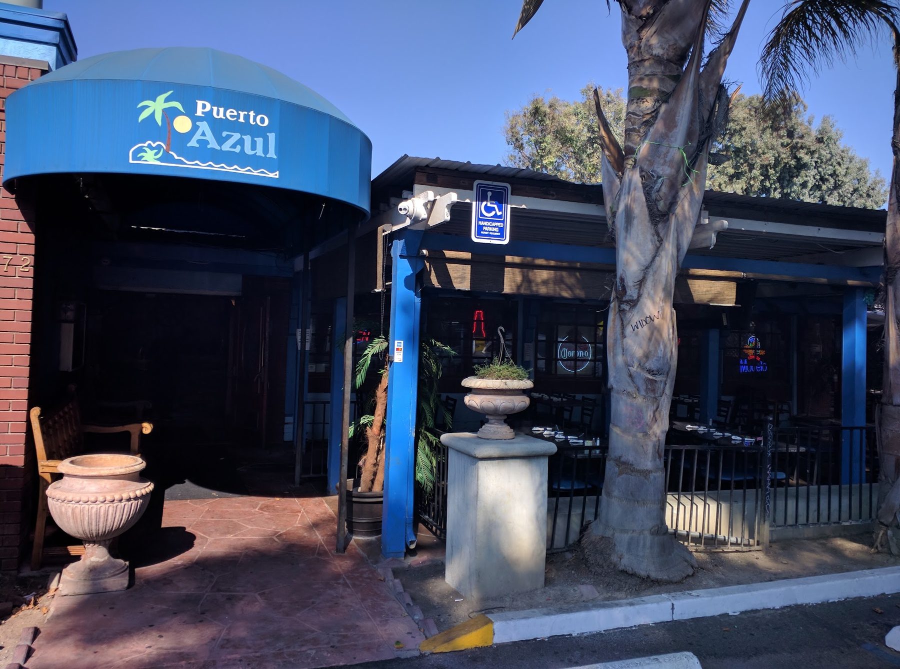The blue entrance canopy of Puerto Azul Restaurant