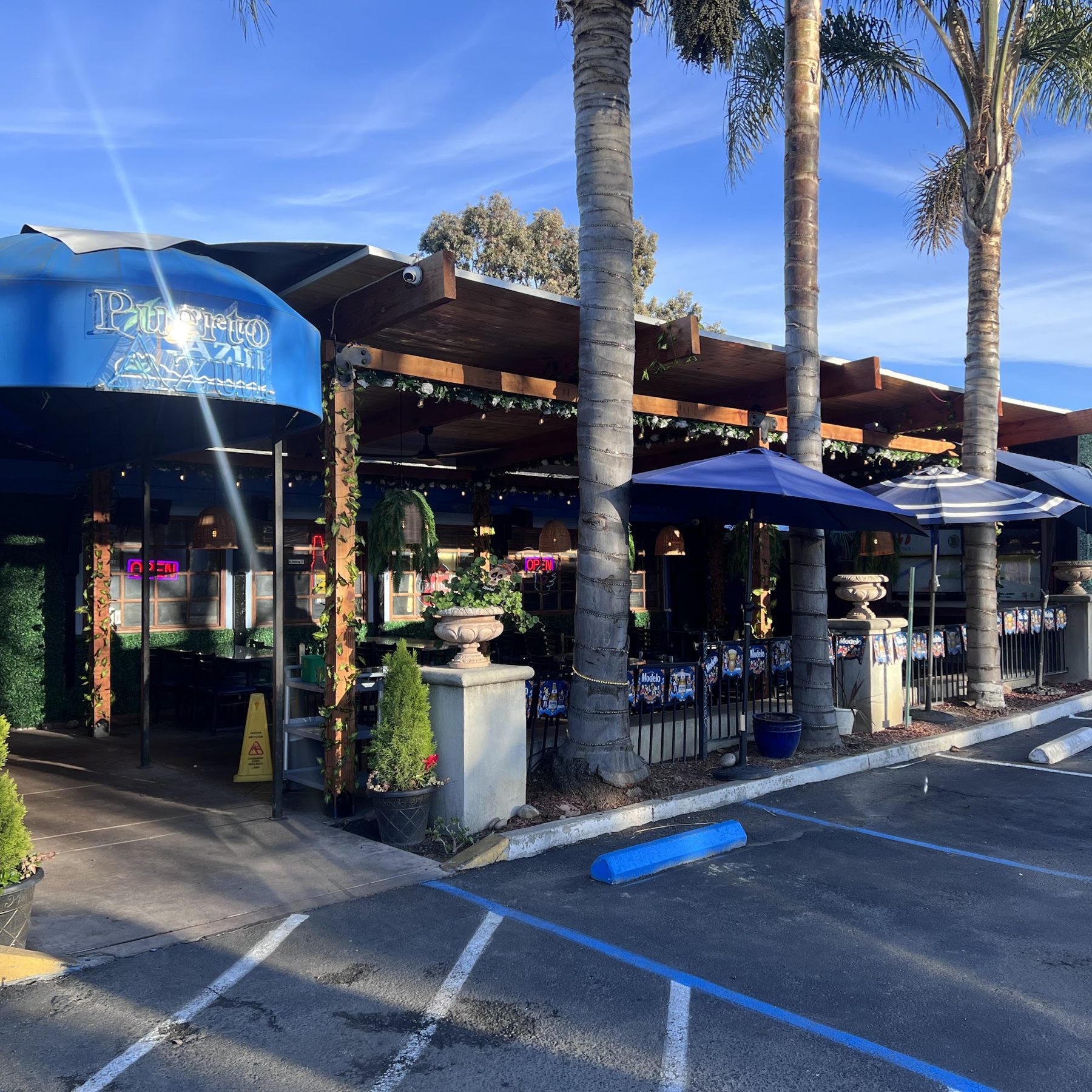 The restaurant frontage with blue awnings