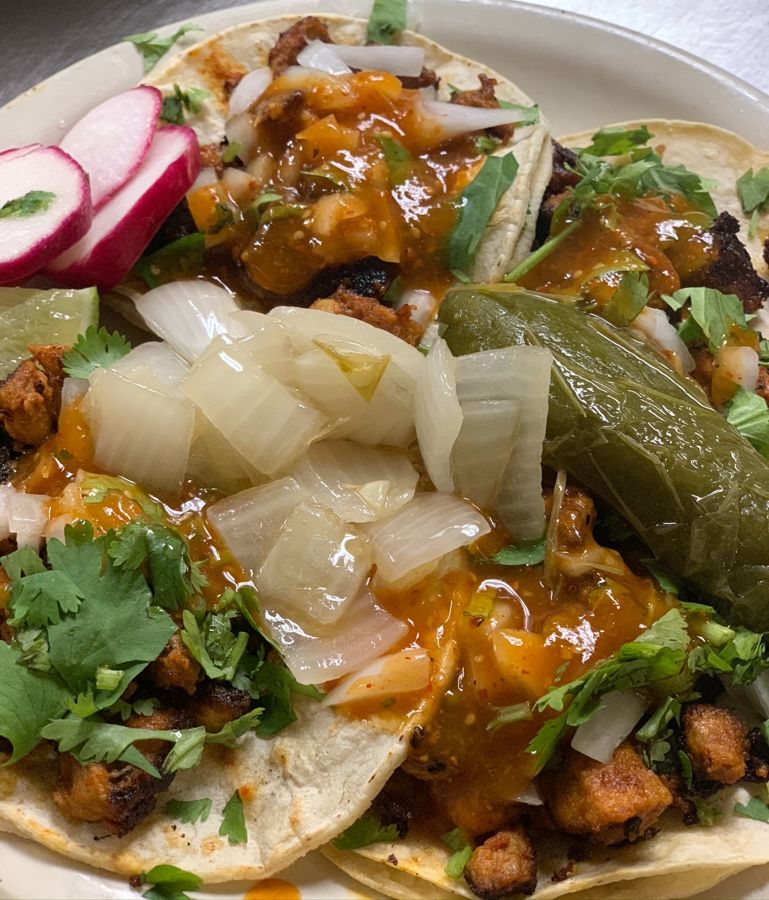 Street tacos with radish, grilled onion and salsa
